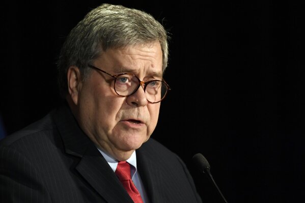 FILE - In this Feb. 10, 2020, file photo Attorney General William Barr speaks at the National Sheriffs' Association Winter Legislative and Technology Conference in Washington. Barr vowed in an interview with The Associated Press Tuesday, March 17, that there would be swift and severe action if a foreign government is behind disinformation campaigns aimed at spreading fear in the U.S. amid the coronavirus pandemic or a denial of service attack on the networks of the Department of Health and Human Services.  (AP Photo/Susan Walsh, File)
