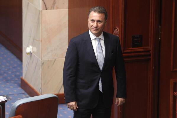 FILE - Nikola Gruevski, Macedonia's former prime minister, looks on in parliament in the capital, Skopje, Oct. 19, 2018. A court in North Macedonia has imposed a new prison sentence on the country’s fugitive former prime minister Nikola Gruevski, this time a 6-year-term for abuse of power over the financing of his party’s headquarters in the capital, Skopje. (AP Photo/Boris Grdanoski, File)