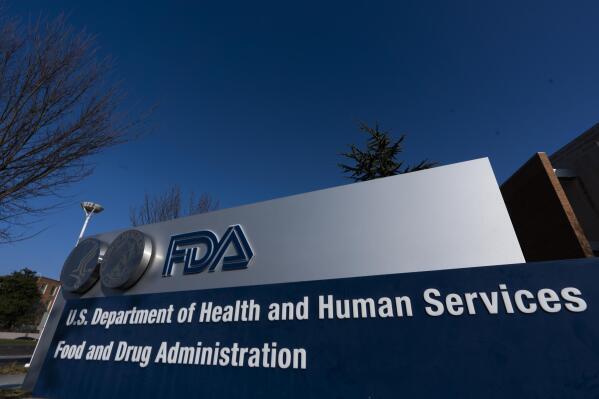 FILE - A sign in front of the Food and Drug Administration building is seen on Dec. 10, 2020, in Silver Spring, Md. The FDA's tobacco division is plagued by a lack of clear direction and priorities that have hampered its ability to regulate electronic cigarettes and other products under its oversight, according to a report released Monday, Dec. 19, 2022. (AP Photo/Manuel Balce Ceneta, File)