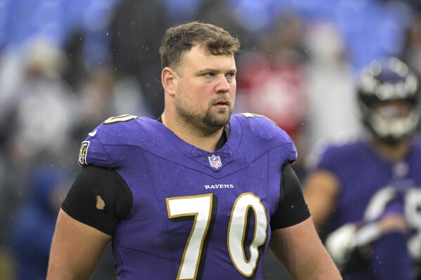 FILE - Baltimore Ravens guard Kevin Zeitler looks on during pre-game warm-ups before an NFL football game against the Los Angeles Rams, Dec. 10, 2023, in Baltimore. The Detroit Lions and Pro Bowl guard Zeitler have agreed to a one-year contract, a person familiar with the situation told The Associated Press on Monday, March 18, 2024. (AP Photo/Terrance Williams, File)