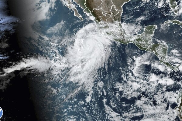 This satellite image taken at 10:50am EDT on Thursday, Aug. 17, 2023, and provided by the National Oceanic and Atmospheric Administration (NOAA) shows Hurricane Hilary off the Pacific coast of Mexico. (NOAA via AP)