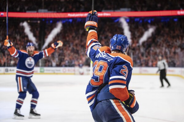 Edmonton Oilers' Leon Draisaitl (29) celebrates a goal against the Dallas Stars during the second period of Game 4 of the Western Conference final in the NHL hockey Stanley Cup playoffs, Wednesday, May 29, 2024, in Edmonton, Alberta. (Jason Franson/The Canadian Press via AP)