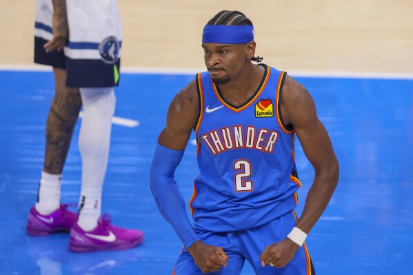 Oklahoma City Thunder guard Shai Gilgeous-Alexander reacts after a play against the Minnesota Timberwolves during the first half of Game 2 of an NBA basketball Western Conference Finals playoff series Thursday, May 22, 2025, in Oklahoma City. (AP Photo/Nate Billings)