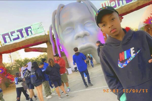 This photo provided by Taylor Blount shows Ezra Blount, 9, posing outside the Astroworld music festival in Houston on Nov. 5, 2021. Ezra has become the youngest person to die from injuries sustained during a crowd surge at the Astroworld music festival. Ezra, of Dallas, died Sunday, Nov. 14 at Texas Children’s Hospital in Houston, family attorney Ben Crump said. (Courtesy of Taylor Blount via AP)