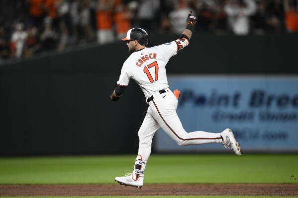 Baltimore Orioles' Colton Cowser celebrates his two-run home run against the Atlanta Braves during the eighth inning of a baseball game Wednesday, June 12, 2024, in Baltimore. (AP Photo/Nick Wass)