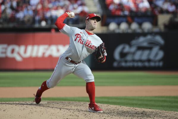 Philadelphia Phillies' David Robertson throws during the eighth inning in Game 1 of a National League wild-card baseball playoff series against the St. Louis Cardinals, Friday, Oct. 7, 2022, in St. Louis. (AP Photo/Scott Kane)