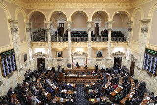 Maryland lawmakers in the House of Delegates work on Monday, March 18, 2024, in Annapolis, Md., with three weeks remaining in their legislative session. (AP Photo/Brian Witte)