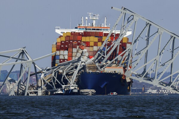 Wreckage of the Francis Scott Key Bridge rests on the container ship Dali, Saturday, March 30, 2024, in Baltimore, Md. (AP Photo/Julia Nikhinson)