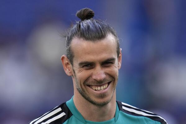 Real Madrid's Gareth Bale smiles during a training session at the Stade de France in Saint Denis near Paris, Friday, May 27, 2022. Liverpool and Real Madrid are making their final preparations before facing each other in the Champions League final soccer match on Saturday. (AP Photo/Manu Fernandez)