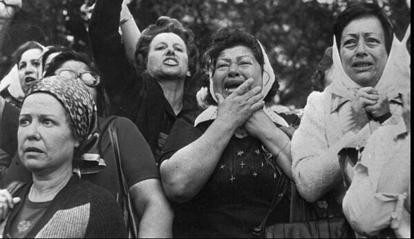 FILE - Members of the Mothers of Plaza de Mayo protest in San Martin Square in Buenos Aires, Argentina, Nov. 21, 1977. Week after week, since April 1977, the mothers of disappeared children have gathered at the square that provided the group with its name, despite being discredited during the dictatorship as “crazy” and “terrorists.” (AP Photo/Eduardo Di Baia, File)