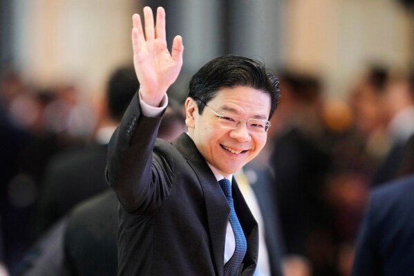 Singapore's Prime Minister Lawrence Wong arrives to participate in ASEAN-China summit in Vientiane, Laos, on Oct. 10, 2024. (AP Photo/Sakchai Lalit, File)