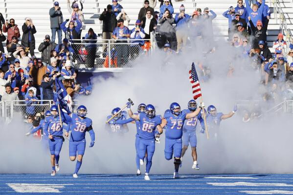 Boise State tight end Matt Lauter (85) carries the hammer as the team runs onto the field before an NCAA college football game for the Mountain West championship against Fresno State, Saturday, Dec. 3, 2022, in Boise, Idaho. (AP Photo/Otto Kitsinger)