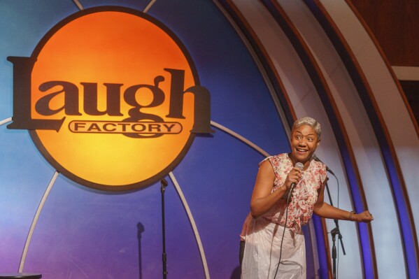 Stand-up comedian and actress Tiffany Haddish entertains guests at Laugh Factory Hollywood, during its free Thanksgiving meal Thursday, Nov. 23, 2023, in Los Angeles. (AP Photo/Damian Dovarganes)