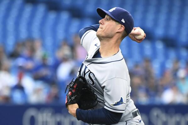 Tampa Bay Rays pitcher Phoenix Sanders, left, throws to first base