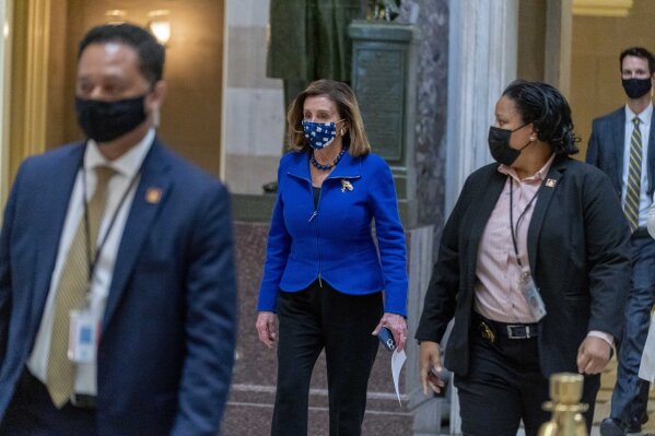 House Speaker Nancy Pelosi of Calif. walks to the House Chamber on Capitol Hill in Washington, Thursday, Feb. 4, 2021. (AP Photo/Andrew Harnik)