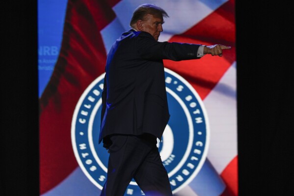 Republican presidential candidate former President Donald Trump gestures at the National Religious Broadcasters convention at the Gaylord Opryland Resort and Convention Center Thursday, Feb. 22, 2024, in Nashville, Tenn. (AP Photo/George Walker IV)