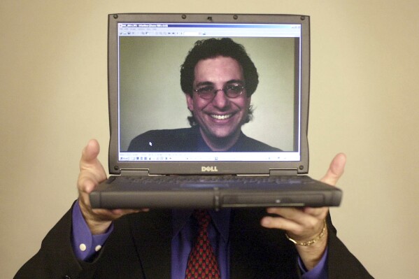 FILE - Computer hacker turned author Kevin Mitnick poses for a portrait Thursday, June 27, 2002, in Las Vegas. Mitnick, whose pioneering antics tricking employees in the 1980s and 1990s into helping him steal software and services from big phone and tech companies made him the most celebrated U.S. hacker, has died at age 59. (AP Photo/Joe Cavaretta, File)