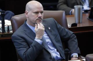 FILE - In this Jan. 5, 2017 file photo, Oklahoma state Rep. Kevin West, R-Moore, listens on the floor of the Oklahoma House in Oklahoma City. Oklahoma public school teachers would be prohibited from teaching certain concepts of race and racism under a bill given final approval by the state House on Thursday, April 29, 2021. Rep. West says the bill would set boundaries that teachers shouldn't cross. Among the concepts that would be prohibited are that individuals are inherently racist, sexist or oppressive, whether consciously or unconsciously. The bill now heads to the governor. (AP Photo/Sue Ogrocki File)