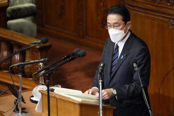 Japanese Prime Minister Fumio Kishida delivers his policy speech at the lower house Monday, Jan. 17, 2022, in Tokyo. Kishida on Monday said fighting the pandemic was a “top priority” in his speech opening this year's parliamentary session, as the Tokyo region was hit by surging infections. (AP Photo/Eugene Hoshiko)