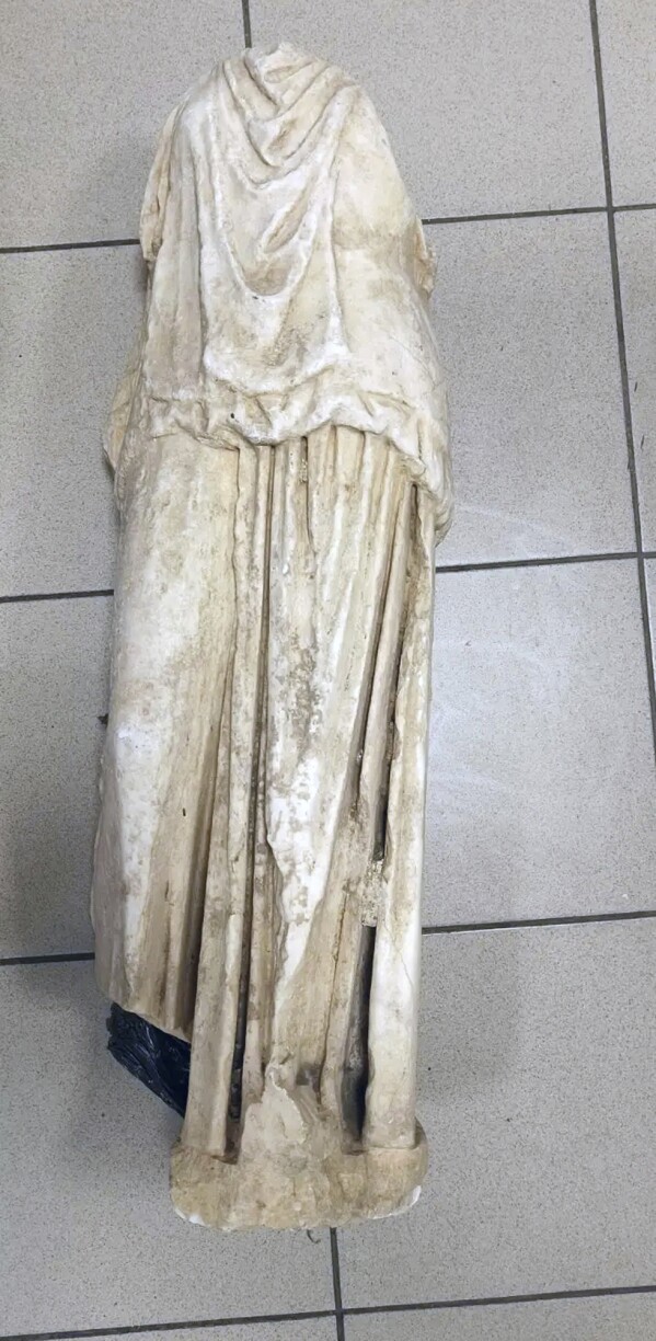 This undated handout photo provided by the Greek Police and released on Wednesday, Jan. 22, 2025 shows a marble statue of a woman believed to be more than 2,000 years old which was found abandoned in a garbage bag in the northern city of Thessaloniki, Greece. (Greek Police via AP)