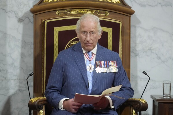 King Charles speaks of the throne in the Senate in Ottawa, Canada, on Tuesday, May 27, 2025, (Adrian Wyld/The Canadian Press via AP)