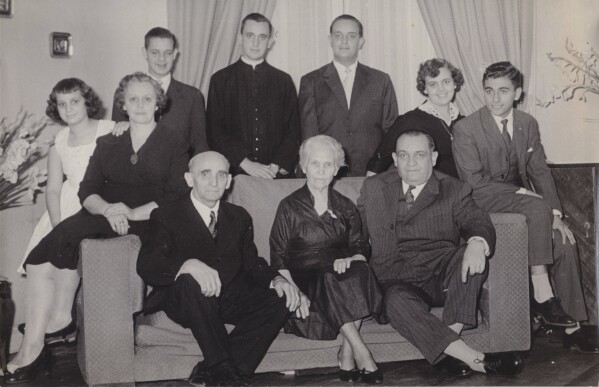 This undated handout reproduction of a photo made available by Maria Elena Bergoglio, shows the Bergoglio family as they pose for a portrait, in Buenos Aires, Argentina. Top row, from left; Maria Elena, Regina Sivori, Alberto, Jorge Mario, Oscar, Marta and her husband Enrique Navaja. Bottom row, from right; Mario, Maria de Bergoglio and Juan. Mario and Regina were the parents of Jorge Mario, Maria Elena, Oscar, Marta and Alberto. Juan and Maria were Mario Bergoglio's parents, Jorge Mario's paternal grandparents. (Bergoglio family photo via AP, File)