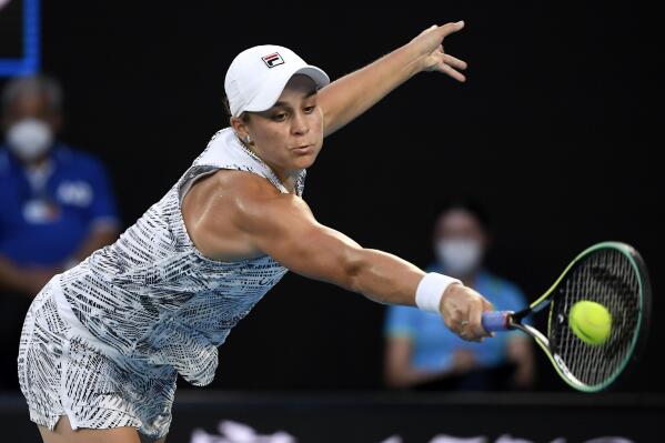 Ash Barty of Australia plays a backhand return to Jessica Pegula of the U.S. during their quarterfinal match at the Australian Open tennis championships in Melbourne, Australia, Tuesday, Jan. 25, 2022. (AP Photo/Andy Brownbill)