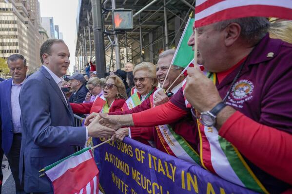 FILE - Republican candidate for New York Governor Rep. Lee Zeldin, front left, greets spectators as he marches up 5th Avenue during the annual Columbus Day Parade, Monday, Oct. 10, 2022, in New York. (AP Photo/Mary Altaffer, File)