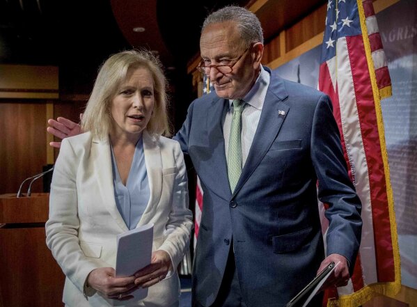 FILE - This photo from Thursday, July 18, 2019, shows Sen. Chuck Schumer of N.Y. and Sen. Kirsten Gillibrand, D-N.Y., departing a news conference at Capitol Hill in Washington. Schumer and Gillibrand, and most of the other 29 members of New York's congressional delegation, have called for Gov. Andrew Cuomo to resign over allegations of sexual harassment, while the state Assembly has announced an impeachment investigation. (AP Photo/Andrew Harnik, File)