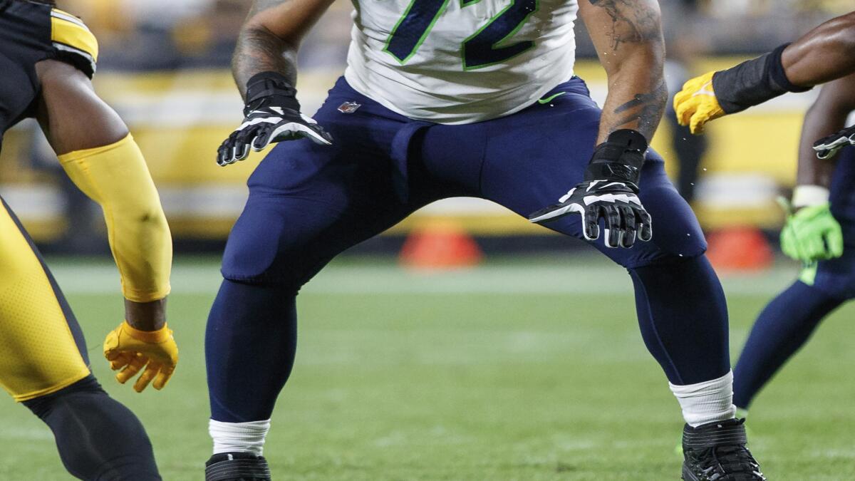 Rookies Cross, Lucas passing early tests on Seahawks O-line - The