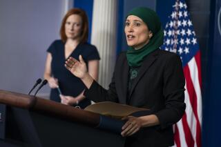 White House press secretary Jen Psaki listens as deputy director of the National Economic Council Sameera Fazili speaks during a press briefing at the White House, Tuesday, June 8, 2021, in Washington. (AP Photo/Evan Vucci)