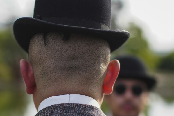 Enzo Restovic attends an Old Fashioned Fest at a park in Santiago, Chile, Saturday, April 5, 2025. (AP Photo/Esteban Felix)