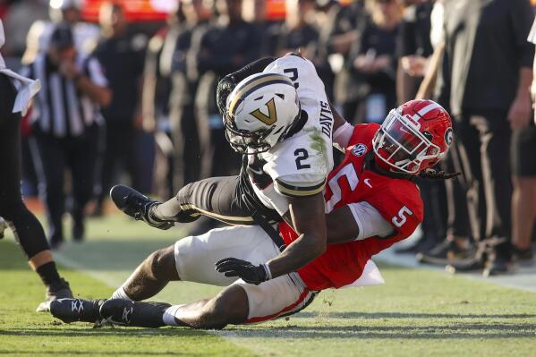 Vanderbilt running back Ray Davis (2) is tackled by Georgia defensive back Kelee Ringo (5) in the second half of an NCAA college football game Saturday, Oct. 15, 2022, in Athens, Ga. (AP Photo/Brett Davis)