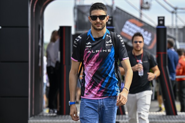Alpine driver Esteban Ocon of France arrives in the paddock before of the third free practice ahead of Sunday's Formula One Hungarian Grand Prix auto race, at the Hungaroring racetrack in Mogyorod, near Budapest, Hungary, Saturday, July 20, 2024. (ĢӰԺ Photo/Denes Erdos)