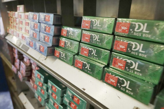 FILE - Menthol cigarettes and other tobacco products are displayed at a store in San Francisco on May 17, 2018. White House officials will take more time to review a sweeping plan from U.S. health regulators to ban menthol cigarettes, an unexpected delay that anti-tobacco groups fear could scuttle the long-awaited rule. Biden administration officials indicated Wednesday, Dec. 6, 2023 the process will continue into next year, targeting March to implement the rule, according to a regulatory agenda posted online. Previously, the rule was widely expected to be published in early January. (APPhoto/Jeff Chiu, File)