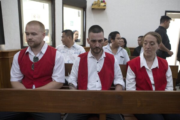 British nationals, from left, Phineas Float, Jonathan Collyer, and Lisa Stocker who are accused of smuggling nearly a kilogram (over two pounds) of cocaine into Indonesia sit inside the courtroom before the start of their trial hearing at Denpasar District Court in Denpasar, Bali, on Tuesday, June 3, 2025. (AP Photo/Firdia Lisnawati)