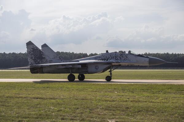 FILE - A view of a MIG-29 fighter jet, at the 11th SIAF International Aviation Day at the Malacky-Kuchyna Air Base, in Kuchyna, Slovakia, Saturday, Aug. 27, 2022. Slovakia’s government has approved a plan to give Ukraine its fleet of Soviet-era MiG-29 fighter jets. Prime Minister Eduard Heger announced the unanimous decision of his government on Friday, March 17, 2023. (Jaroslav Novak/TASR via AP, File)
