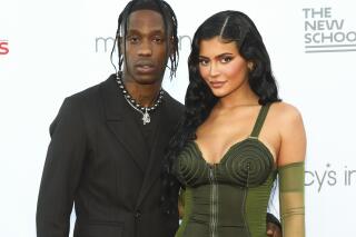 FILE - Recording artist Travis Scott, left, and Kylie Jenner, right, attend the 72nd annual Parsons Benefit presented by The New School at The Rooftop at Pier 17 on Tuesday, June 15, 2021, in New York.  Jenner gave birth to her second baby with Scott on Wednesday, Feb. 2, 2022, according to an announcement on social media on Sunday, Feb. 6.  (Photo by Andy Kropa/Invision/AP, File)