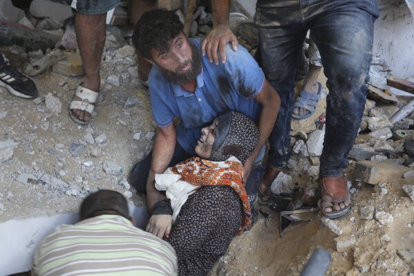 Palestinians evacuate survivors of the Israeli bombardment of the Gaza Strip in Rafah on Monday, Oct. 30, 2023. (AP Photo/Hatem Ali)