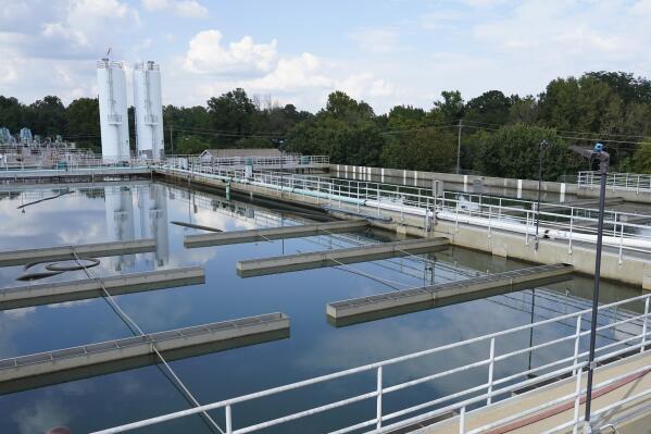 Clouds are reflected off the City of Jackson's O.B. Curtis Water Treatment Facility's sedimentation basins in Ridgeland, Miss., Friday, Sept. 2, 2022. Jackson's water system partially failed following flooding and heavy rainfall that exacerbated longstanding problems in one of two water-treatment plants. (AP Photo/Rogelio V. Solis)