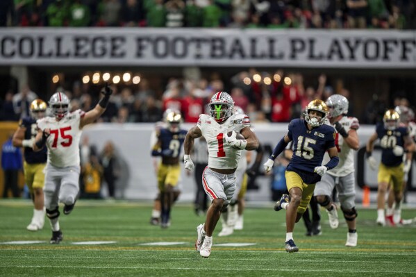 Ohio State running back Quinshon Judkins (1) runs with the ball against Notre Dame during the College Football Playoff national championship game Monday, Jan. 20, 2025, in Atlanta. (AP Photo/Jacob Kupferman, File)
