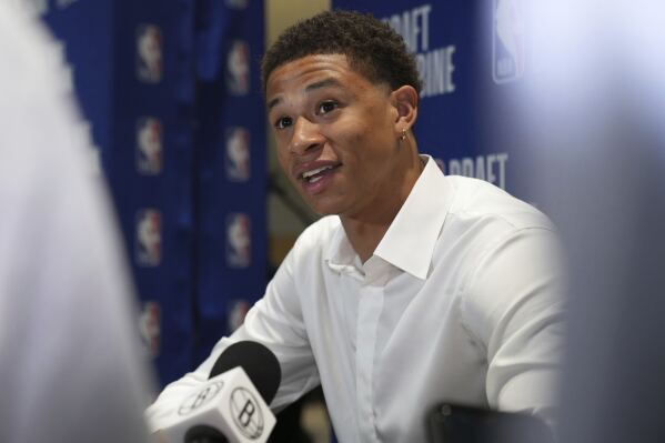 Carter Bryant talks to media at the 2025 NBA basketball Draft Combine in Chicago, Wednesday, May 14, 2025. (AP Photo/Nam Y. Huh)