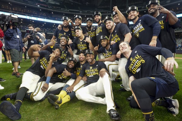 Milwaukee Brewers' Freddy Peralta poses for a picture with a