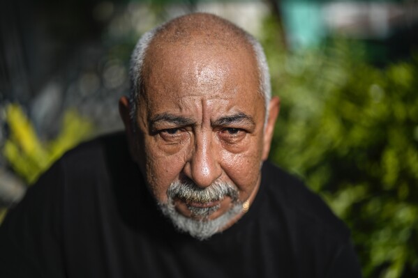Cuban writer Leonardo Padura poses for a portrait at his home in Havana, Cuba, Wednesday, April 10, 2024. Padura has managed to turn his series of detective novels into a social and political chronicle of Cuba, especially his native Havana. (AP Photo/Ramon Espinosa)