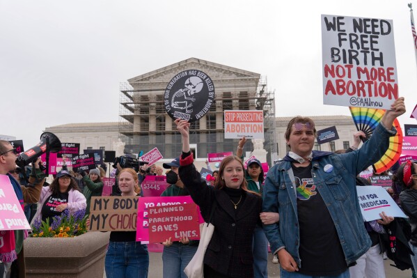 Abortion-rights activists and anti-abortion demonstrators rally outside the Supreme Court in Washington, Wednesday, April 2, 2025. (AP Photo/Jose Luis Magana)