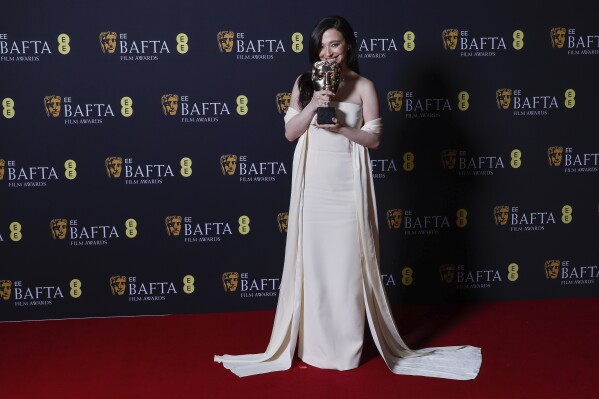 Mikey Madison poses with the leading actress award for 'Anora' at the 78th British Academy Film Awards, BAFTA's, in London, Sunday, Feb. 16, 2025. (Photo by Joel C Ryan/Invision/AP)