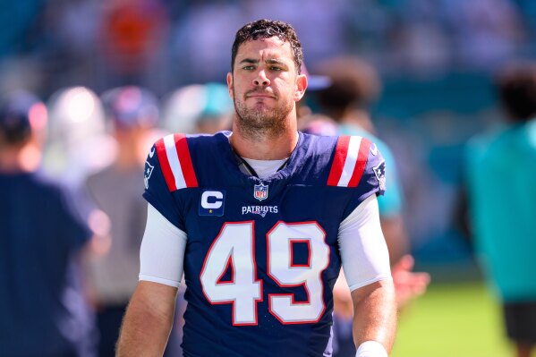 New England Patriots long snapper Joe Cardona (49) walks on the sidelines before an NFL football game against the Miami Dolphins, Sunday, Nov. 24 2024, in Miami Gardens, Fla. (AP Photo/Doug Murray, File)