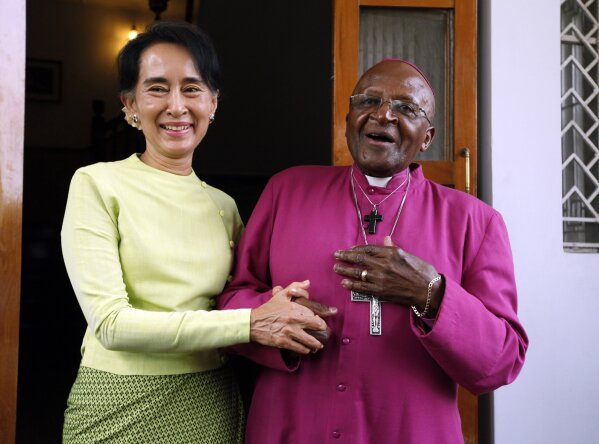 FILE - In this Feb. 26, 2013, file photo, South African Archbishop Desmond Tutu, right, and Myanmar opposition leader Aung San Suu Kyi speak during a press briefing after the Nobel laureates' meeting at her residence in Yangon, Myanmar. As the magnitude of the Rohingya tragedy emerged, 1984 Nobel Peace laureate Archbishop Desmond Tutu felt compelled to appeal to Suu Kyi. (AP Photo/Khin Maung Win, File)