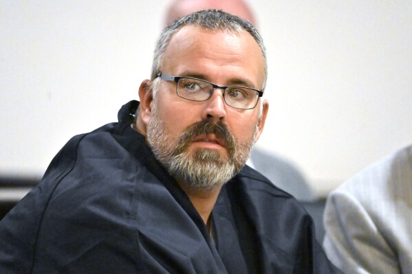 CORRECTS TO HEARING, INSTEAD OF ARRAIGNMENT - Former Letcher County Ky. Sheriff Shawn "Mickey" Stines looks over at the prosecutors during a hearing at the Morgan County Courthouse in West Liberty, Ky., Tuesday, Oct. 1, 2024. Stines is accused of killing District Judge Kevin Mullins. (AP Photo/Timothy D. Easley)