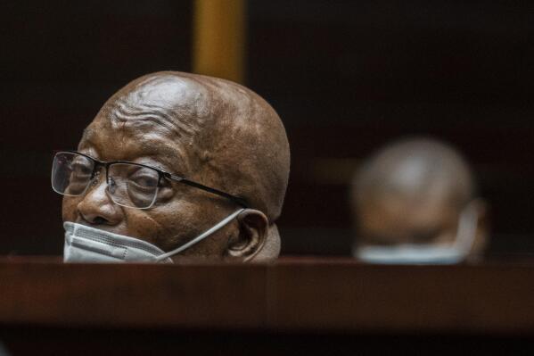 FILE — Former South African President Jacob Zuma, sits in the High Court in Pietermaritzburg, South Africa, Oct. 26, 2021. A South African court on Wednesday, Dec. 15 has ordered Zuma should go back to prison after withdrawing the medical parole given to him earlier this year. (AP Photo/Jerome Delay, File)